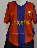 Barcelona sports jersey with Unicef logo on a plain background