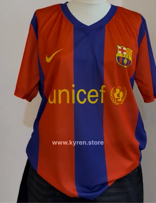 Barcelona sports jersey with Unicef logo on a plain background