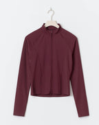 Maroon long-sleeve athletic jacket on a white background