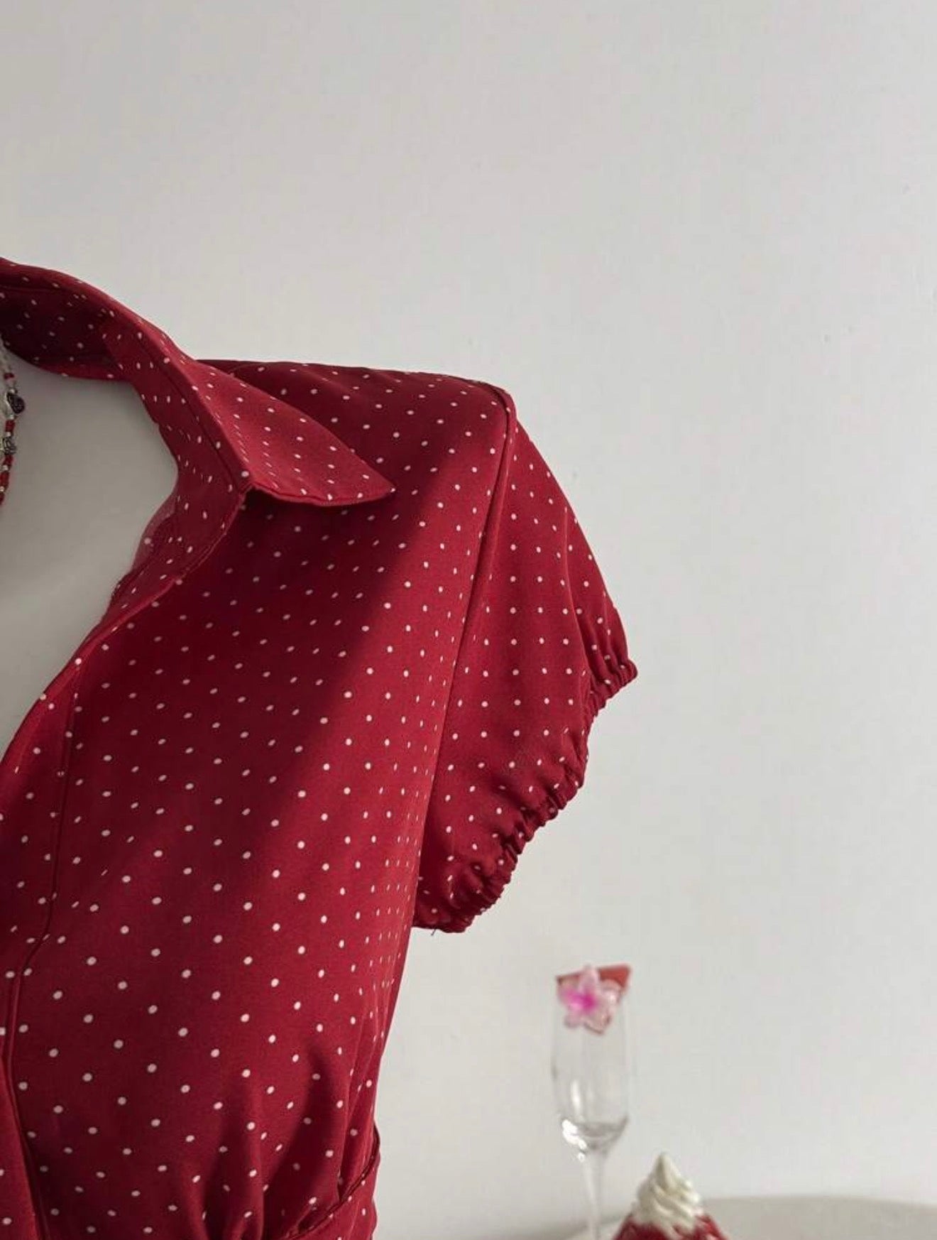 Red polka dot dress with a white background