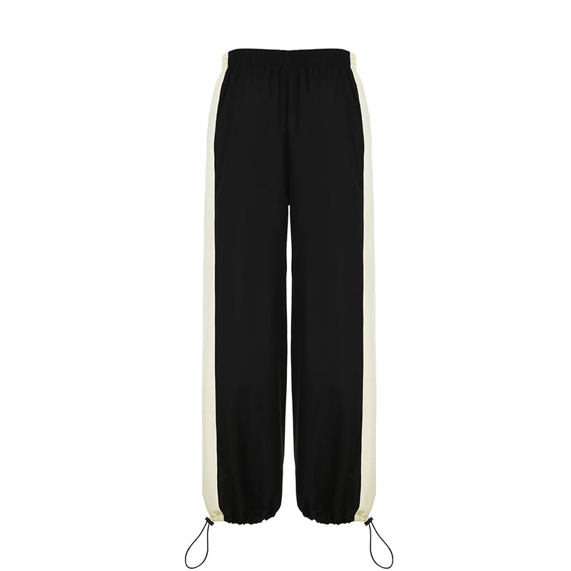 Black pants with white side stripes on a white background