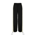 Black pants with white side stripes on a white background