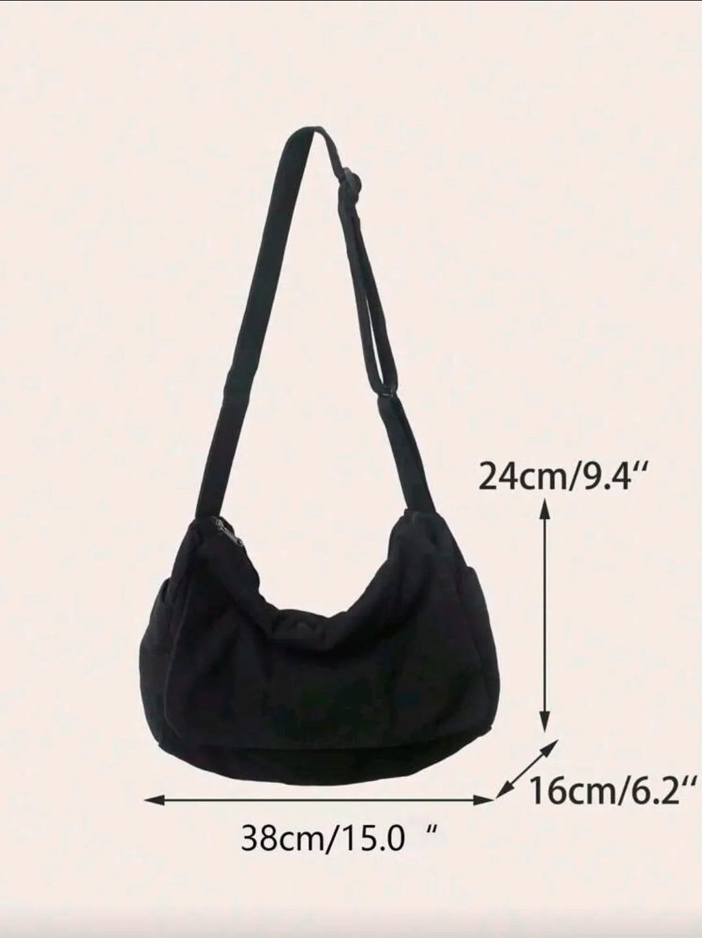 Black shoulder bag with measurements on a beige background