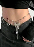 Butterfly-themed waist chain on a person wearing black pants.