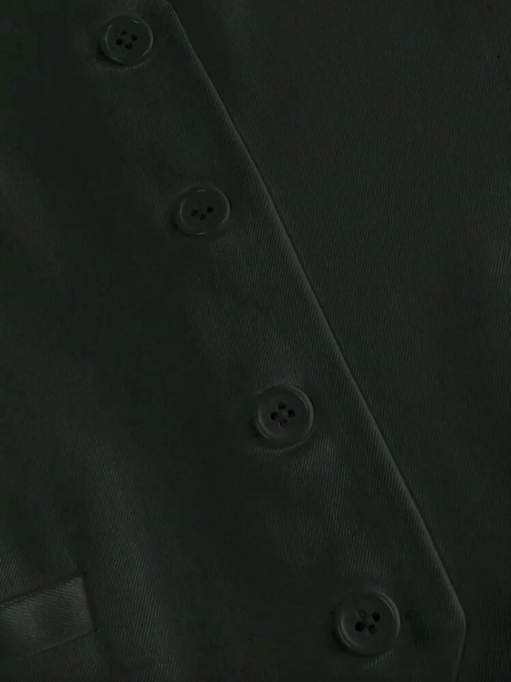 Close-up of a dark gray fabric with button details