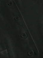 Close-up of a dark gray fabric with button details