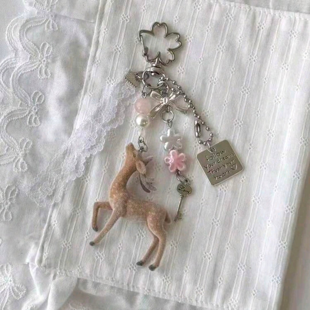 Doe doll and lace medal