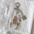 Doe doll and lace medal