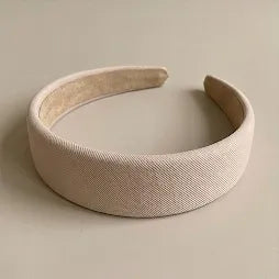 Beige headband on a light gray background