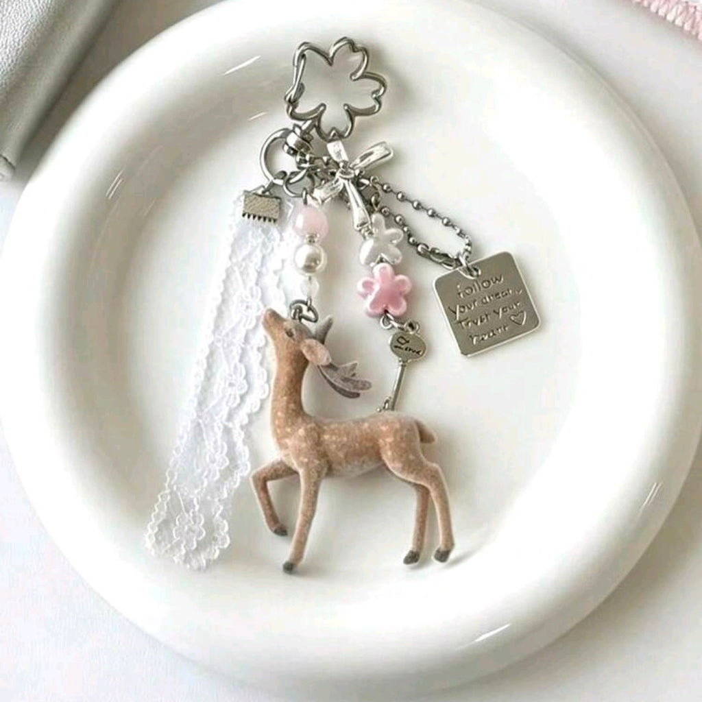 Doe doll and lace medal