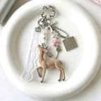 Doe doll and lace medal